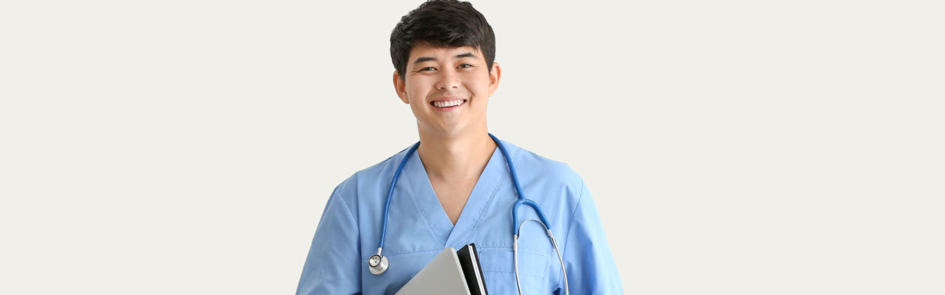 male nurse smiling at the camera